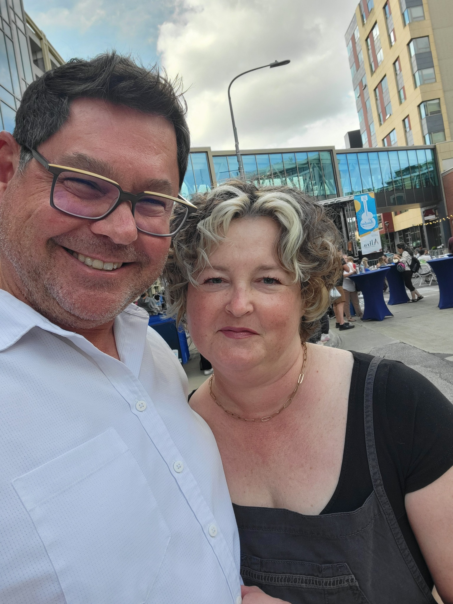 Pastor Aaron and his wife smiling together outdoors